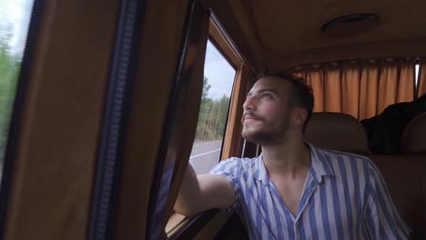 Traveler-young-man-driving-in-car.