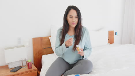 sitting on bed, asian woman eating healthy snacks and relaxing in cozy bedroom, at home
