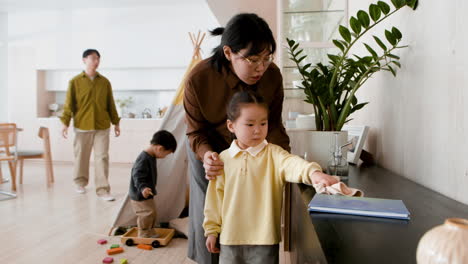 family cleaning and playing together