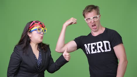 mature asian businesswoman and young scandinavian nerd man together
