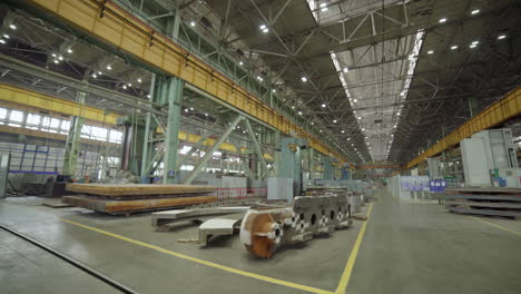 large industrial factory interior with machinery and metal parts