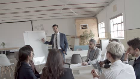 Group-of-employees-listening-presentation