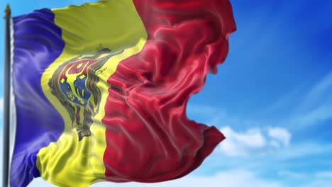 la bandera de moldavia está ondeando lentamente contra el cielo azul.