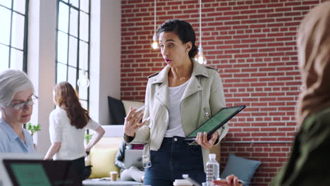 Woman,-tablet-and-team-planning-meeting-in-modern