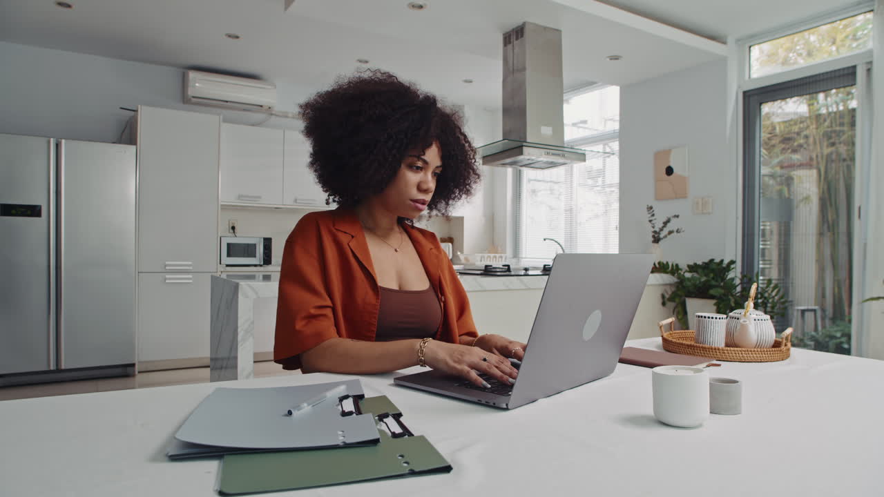 Female Freelancer Working on Laptop from Home