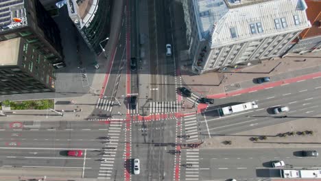 a drone footage of cars, vehicles and public transportation driving on an intersection in tallinn estonia freedom square located in europe, baltics