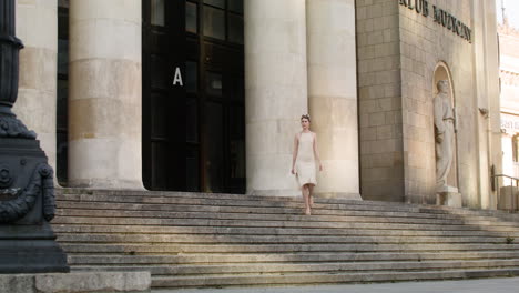 distant view of elegant woman putting the sunglases on