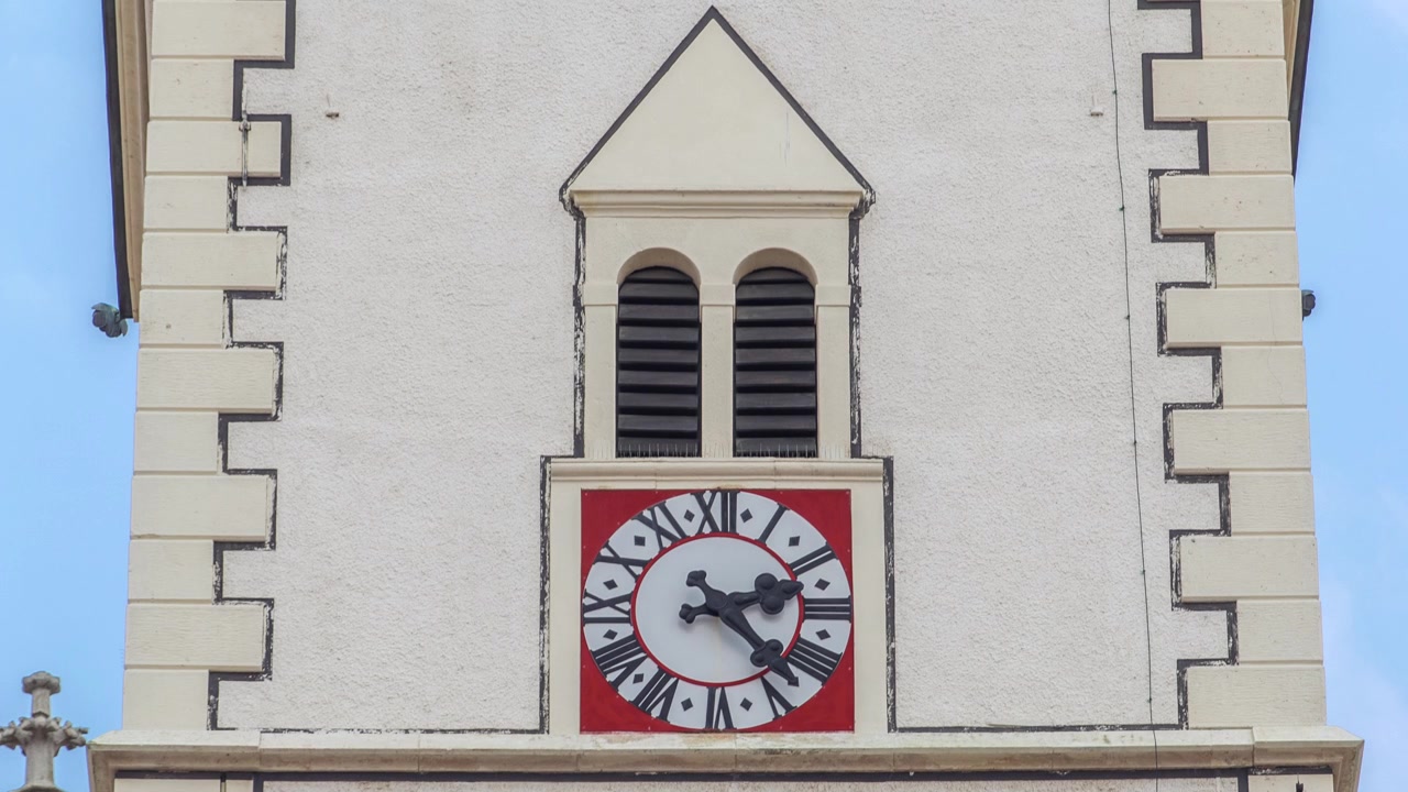 Clock on tower of St. Mark Church at St. Mark Square timelapse. Zagreb, Croatia. Close up view