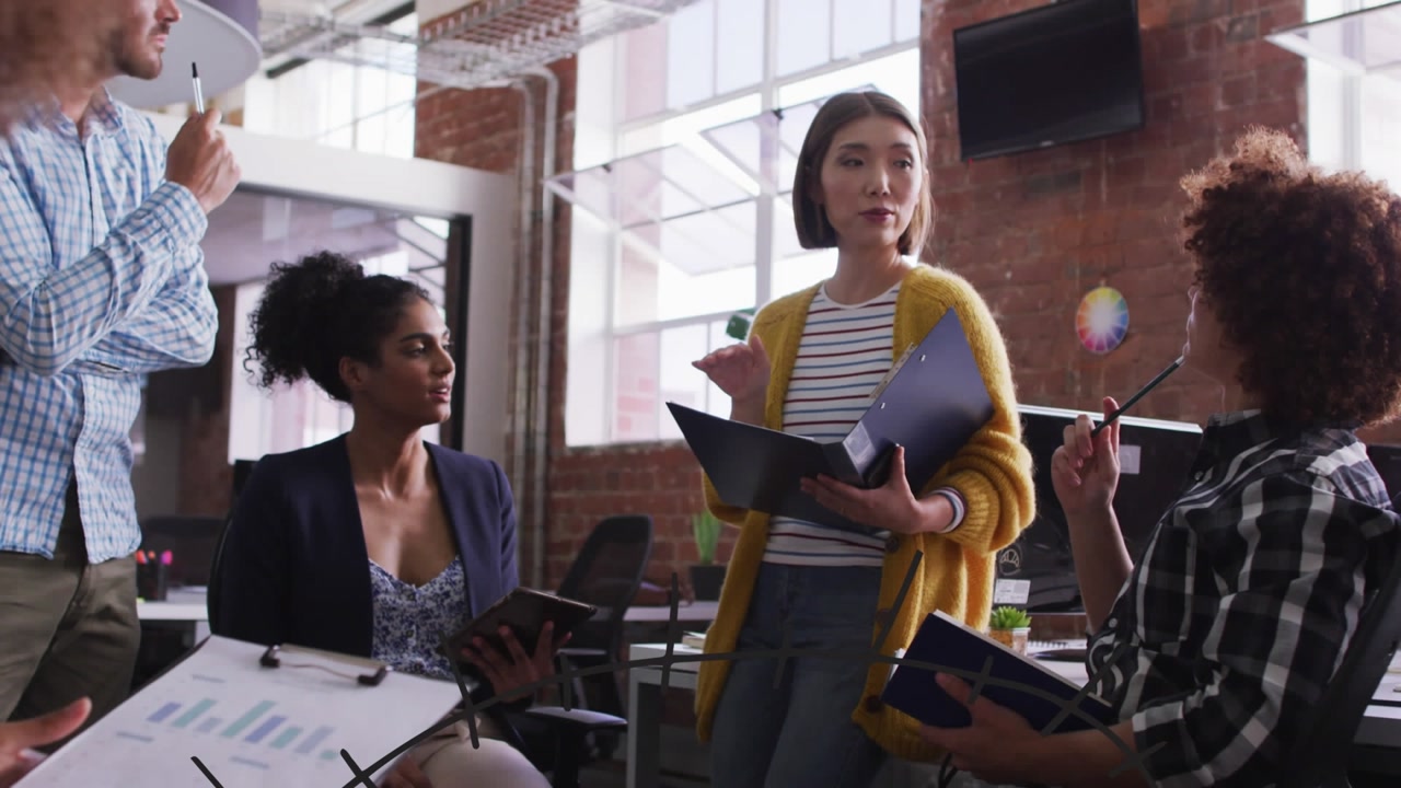 Diverse Business Team Discussing Math Concepts in a Modern Office