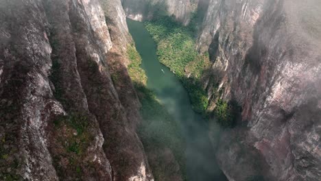 aerial - sumidero canyon and grijalva river through clouds, chiapas, mexico, reveal