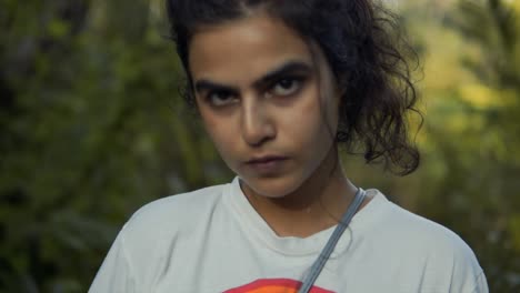 close up a beautiful young asian indian girl wearing a white tshirt with rainbow