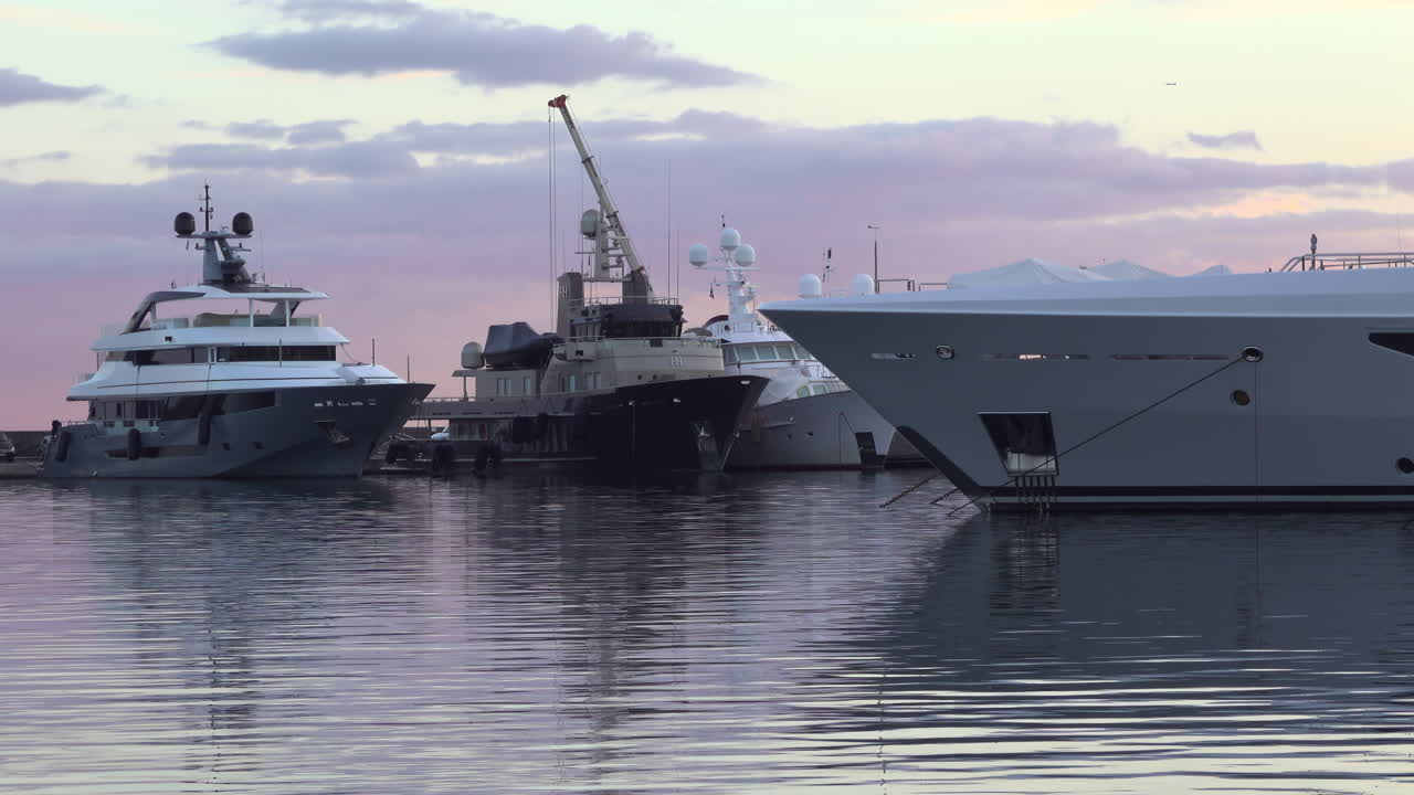 Antibes, France - March 21, 2025: Multiple boats docked in the port in the evening