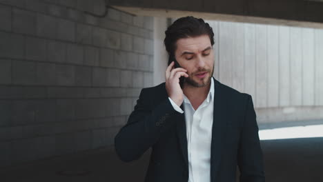 businessman talking on cellphone at street. business man calling on phone