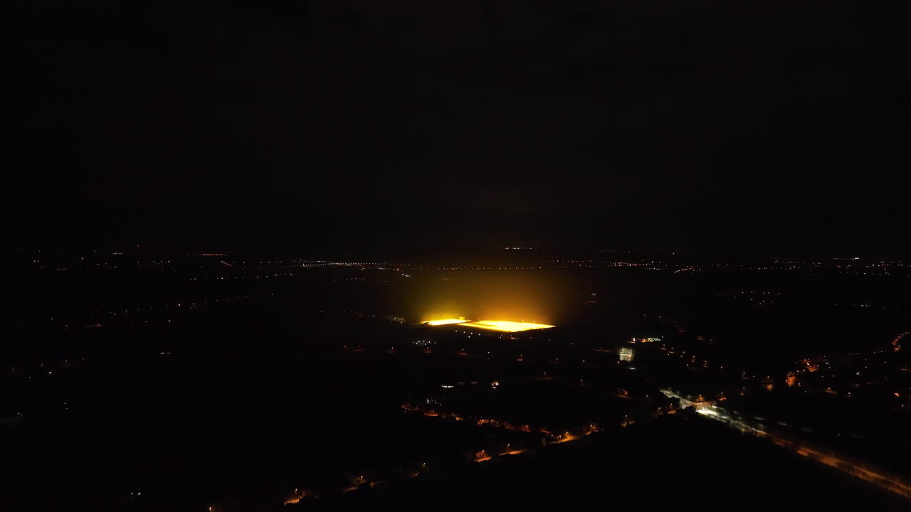 Aerial View of Illuminated Stadium at Night