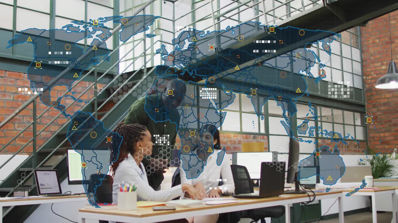 Team huddling at desk reviewing laptop, man showing phone causing data map overlay for business