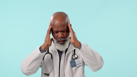 Stress,-headache-and-senior-man-doctor-in-studio