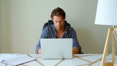 man using laptop at home 4k