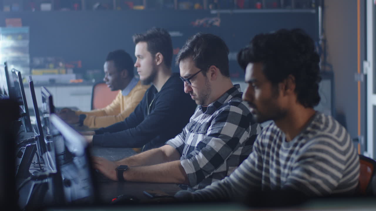 Group of people working on computers in an office