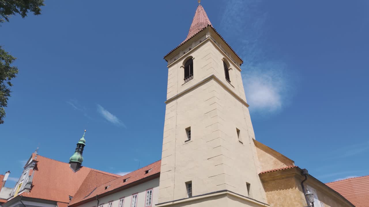 Historic Klášter klarisek monastery courtyard with statue in Český Krumlov on a sunny day