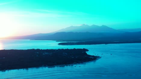 glittering sunrise over tropical islands of indonesia with sea surface reflecting sunlight around shores under bright blue sky
