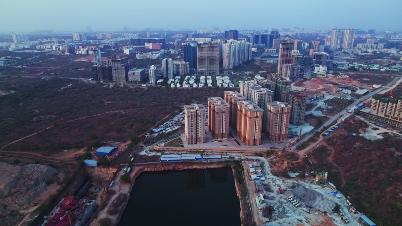aerial view of nanakramguda, financial district with Hillcrest by Pacifica buildings and trees at day time, push in, drone shot, 4k.