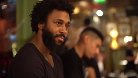 an african man smiling and nodding in slow motion.