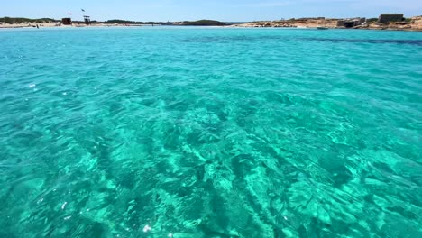 magic boat ride through transparent turquoise water, summer dream vacation destination in formentera island ses illetes beach ibiza spain, 4k shot