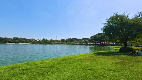 panoramic view of pond and pavilion in park