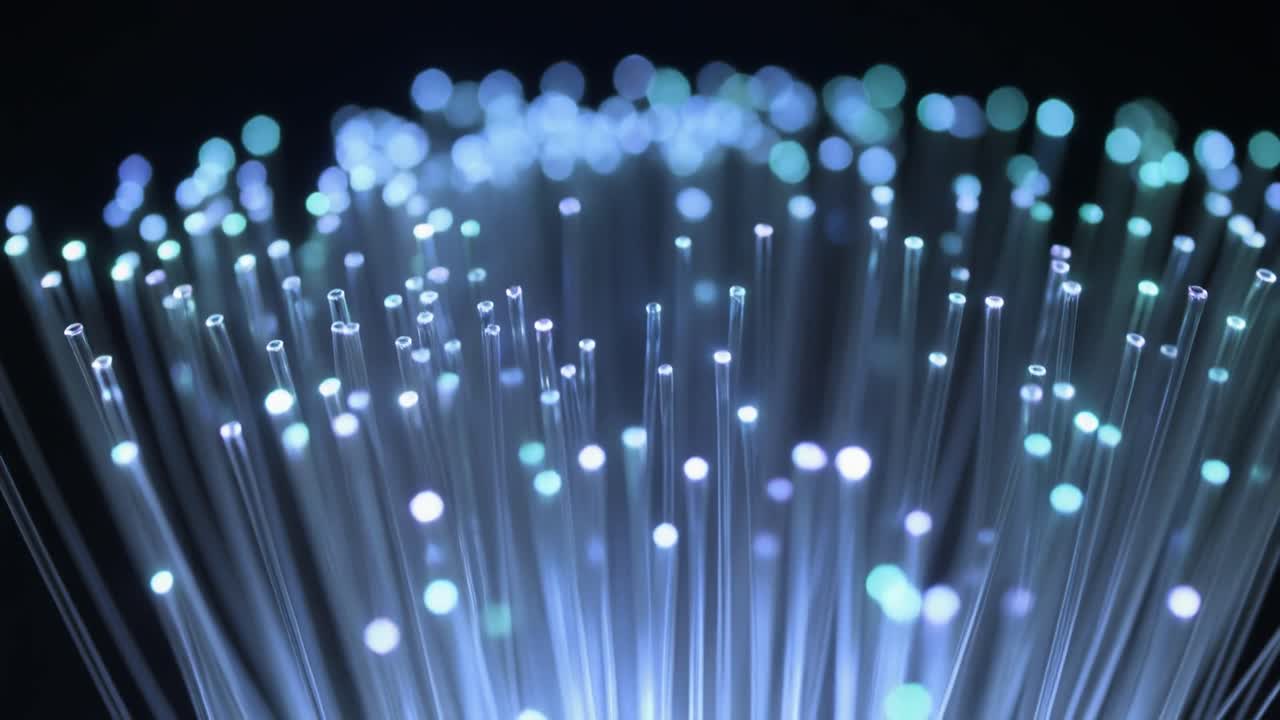 Abstract View of Glowing Fiber Optic Cables Transmitting Data