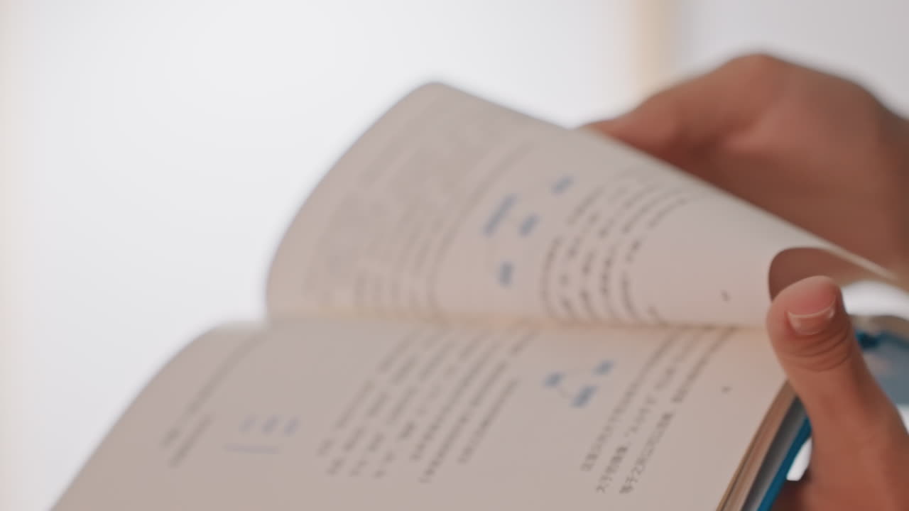 Closeup hands reading hotel guidebook in bright room, hotel guest flipping clean pages, delicate manicure, slow deliberate turns, soft natural light, quiet refined atmosphere, focus on cover edge