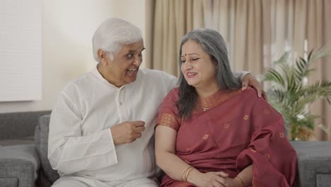 Happy-Indian-old-couple-talking-to-each-other