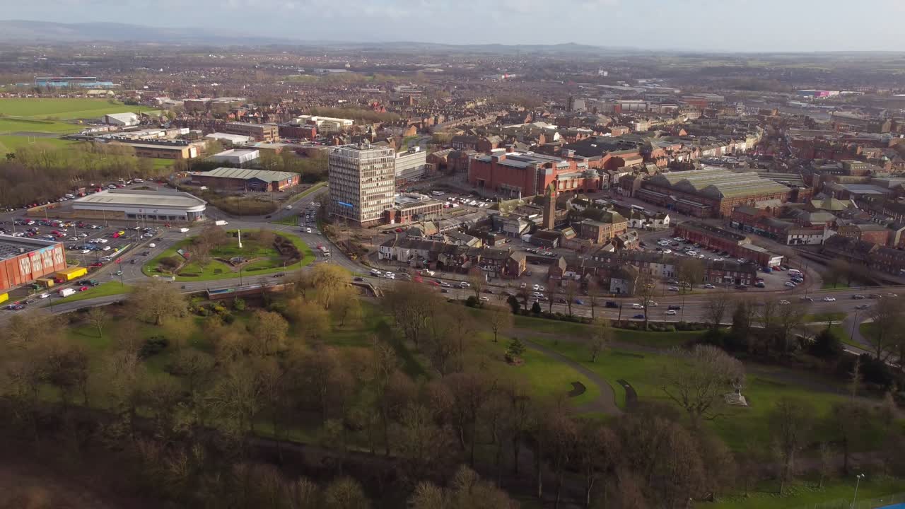 Drone retreating from Carlisle City Centre to reveal River Eden, Cumbria, England