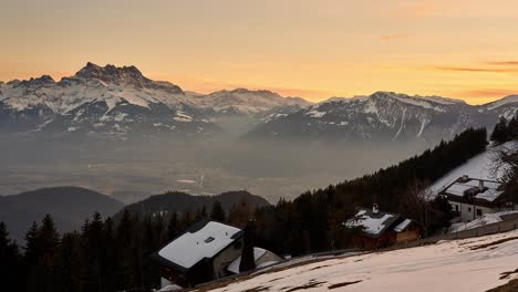 sunset winter timelapse view of snow covered mountains in the swiss alps