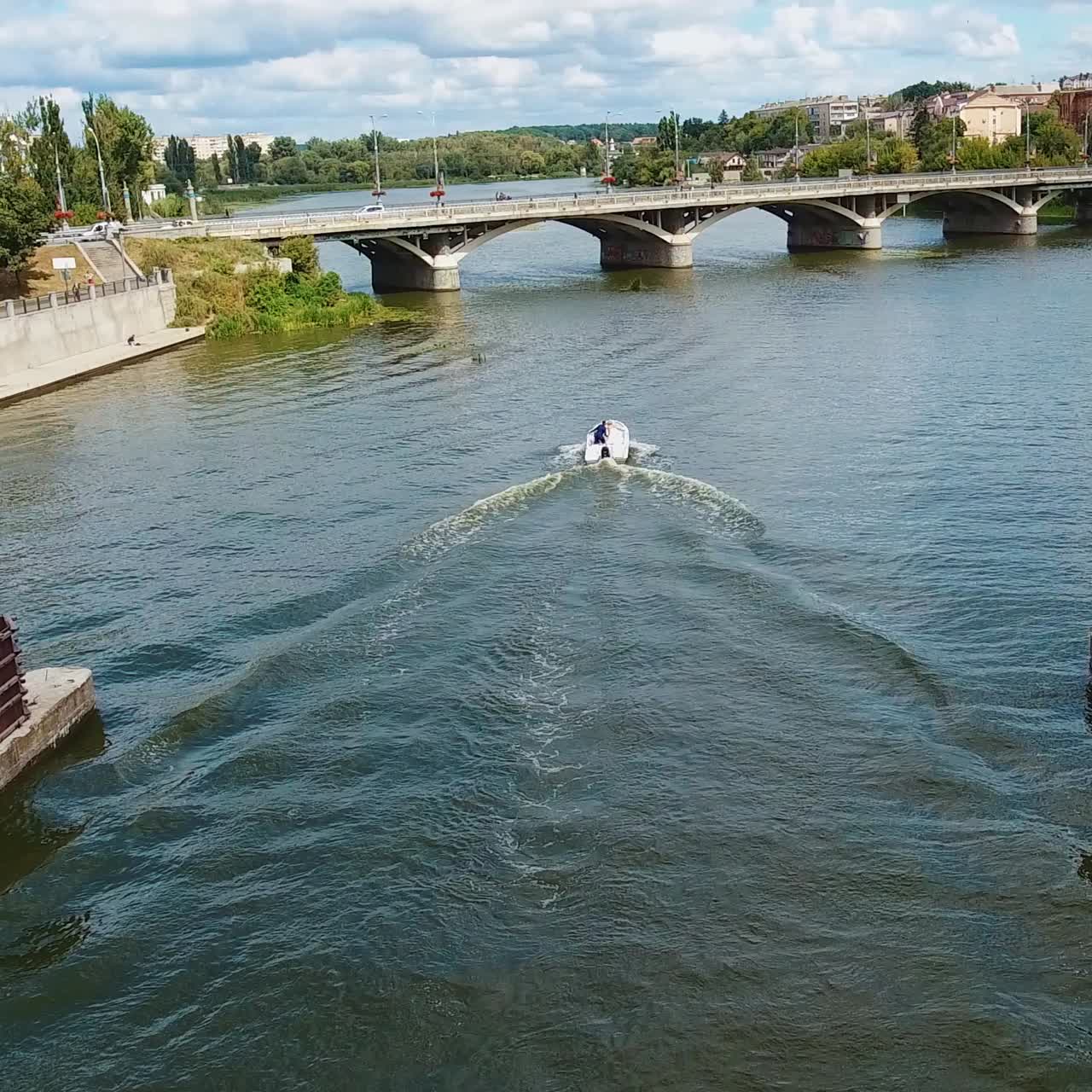 Flying over city river
