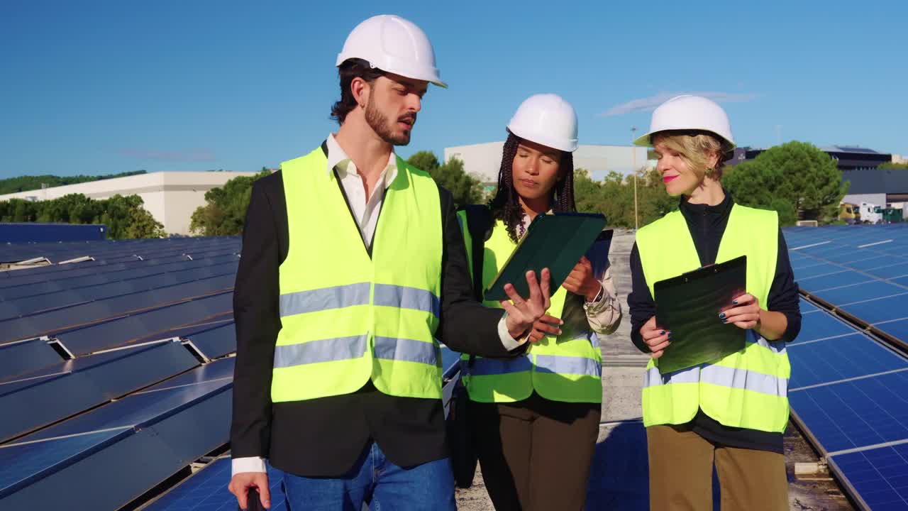 Engineers Inspecting Solar Panels at a Solar Farm