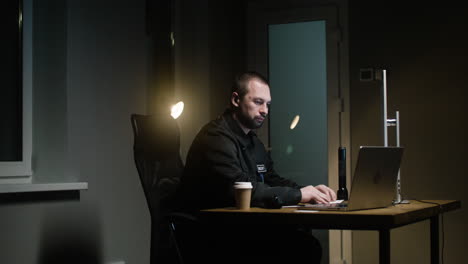 man working in the hut at night