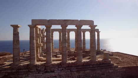 sunny day aerial footage of ancient ruins of temple of poseidon , sounion greece famous monument