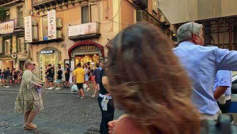 police manage crowd in bustling naples street