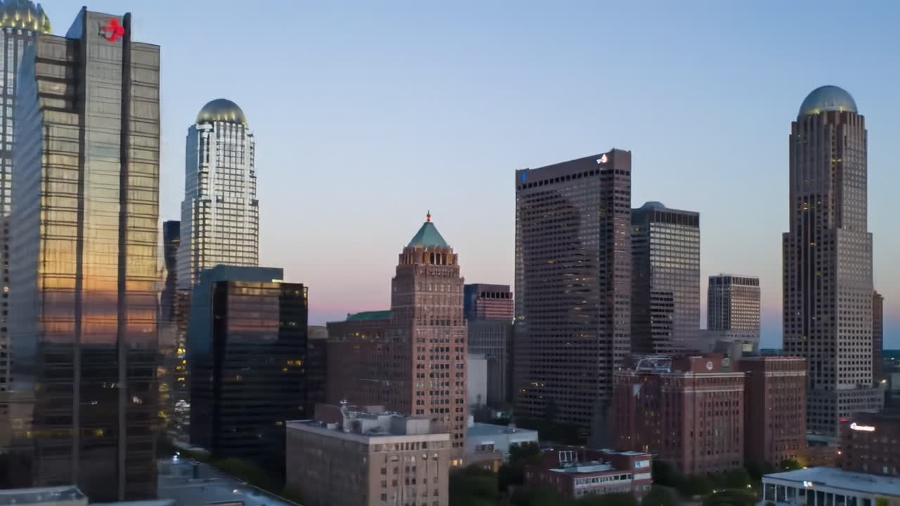 Stunning Cityscape Transition: A Captivating View of a Modern Skyline from Daylight to Nighttime Illuminations Featuring Skyscrapers and Urban Architecture
