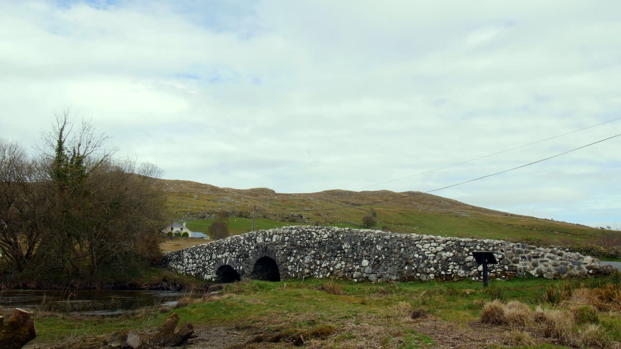 Static establishing shot of the famous Quiet Man Bridge in Connemara, Galway, Ireland.