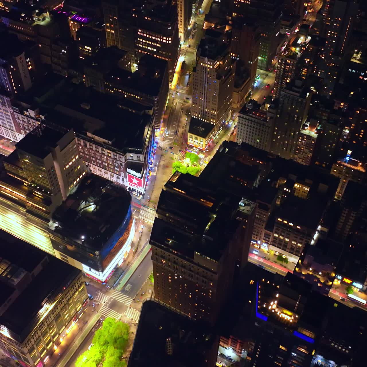 Radiant buildings of vibrant New York. City lights of beautiful metropolis at night. View from above