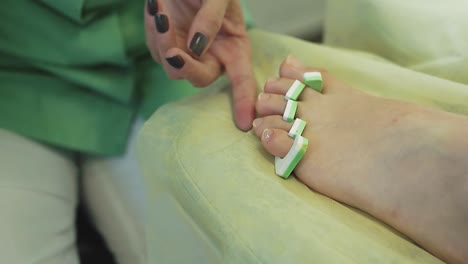 young-pretty-girl-sits-in-a-chair-in-a-beauty-salon