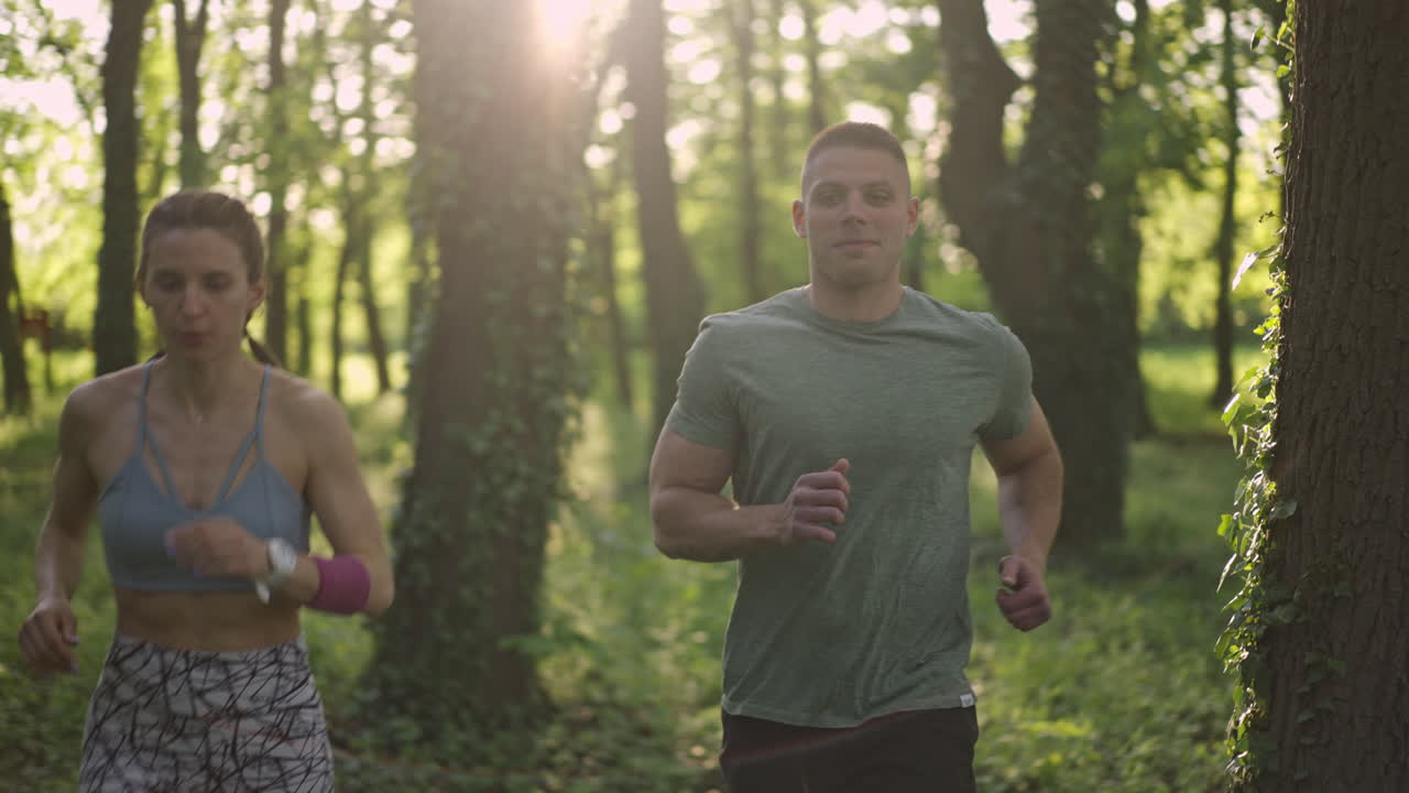 Couple running in a forest
