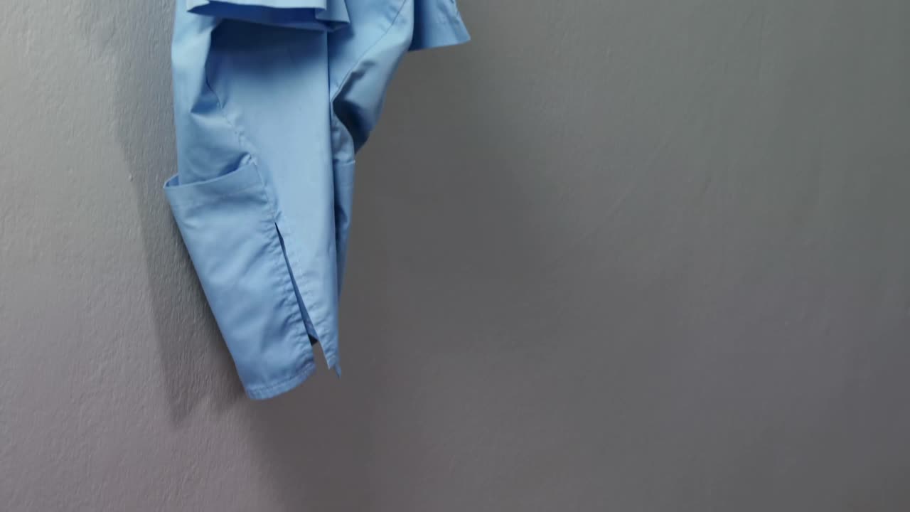 Scrubs hanging on hook 4k