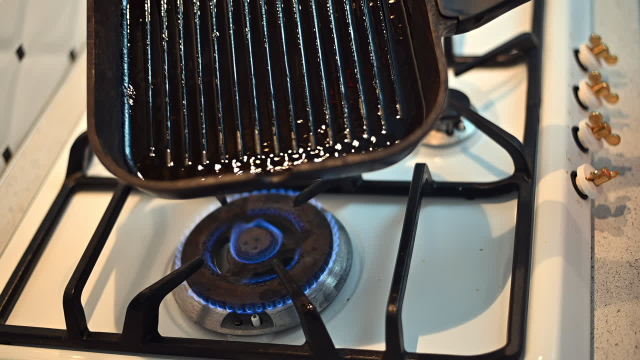 Cooking on a stovetop with a cast iron pan allows for great heat retention and flavor. Watch as the pan heats up, ready for grilling various delicious meals