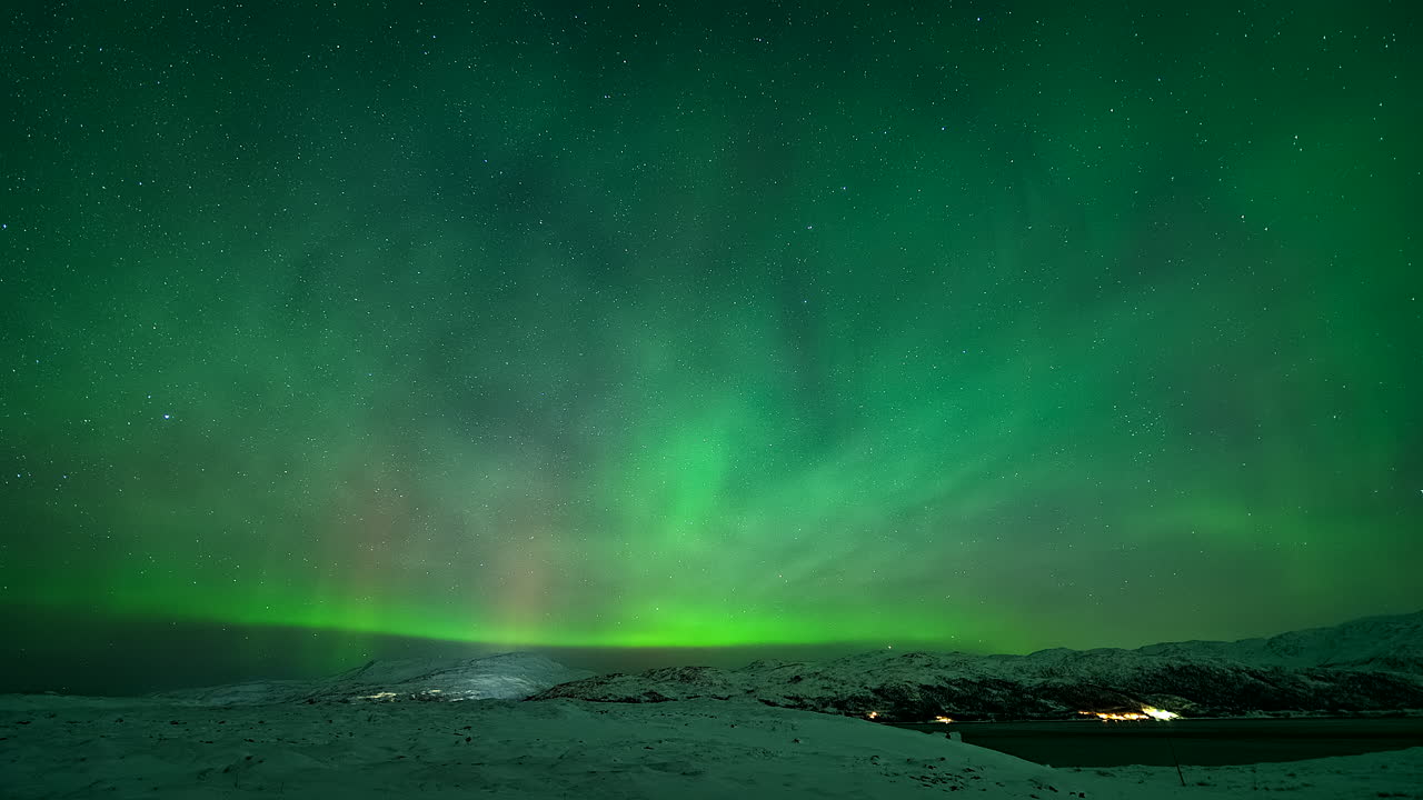 Dancing Lights Over Colorful Sky With Aurora Borealis Near Kvaloyvaagen, Norway. Timelapse