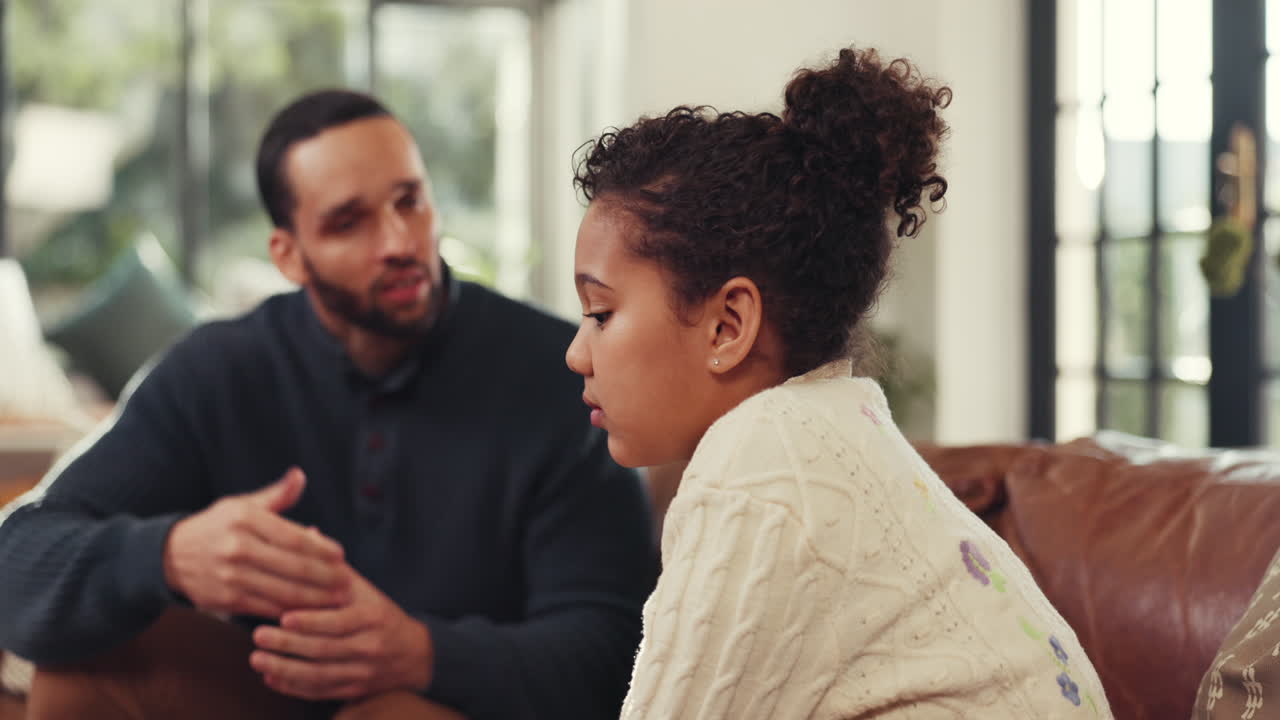 Father and Daughter Having a Serious Conversation at Home