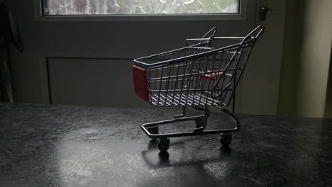 mini empty shopping cart online home supermarket concept copy space closeup slow right dolly