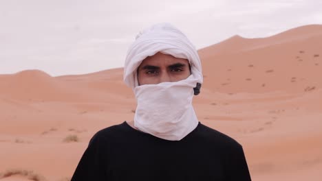 close up shot of moroccan man in sahara desert : morocco , mezouga
