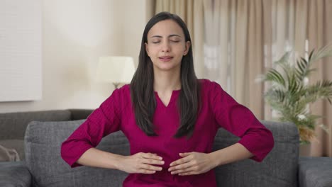 Happy-Indian-woman-doing-breathe-in-breathe-out-exercise